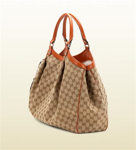 gucci sukey tote gold|Gucci Original GG Canvas Sukey Tote QFB1FK0EKB096 .